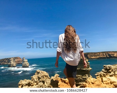 Woman on the cliffs at the Great Ocean Road