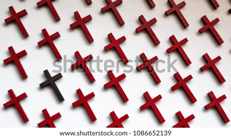 A collection of wooden crosses to depict the loss of life.