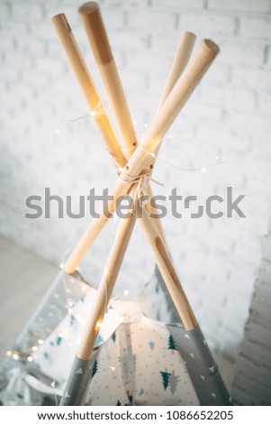 Children's hut made of cloth - wooden sticks