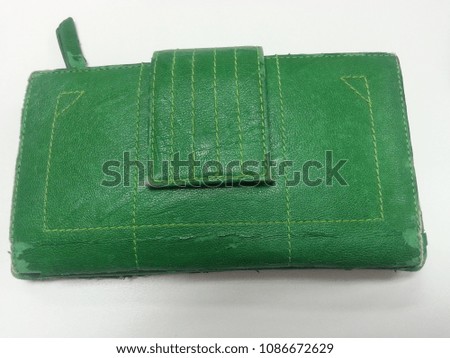 Wallet green color with white black ground.
