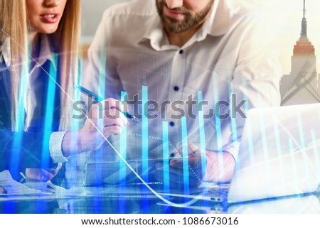Businesspeople working together in modern office with laptop and city view. Teamwork and finance concept. Double exposure 