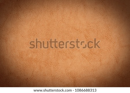 Light brown leather texture surface. Close-up of natural grain cow leather. 