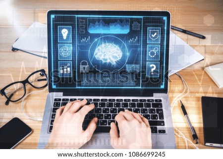 Hands using laptop with digital business interface. Artificial intelligence and finance concept