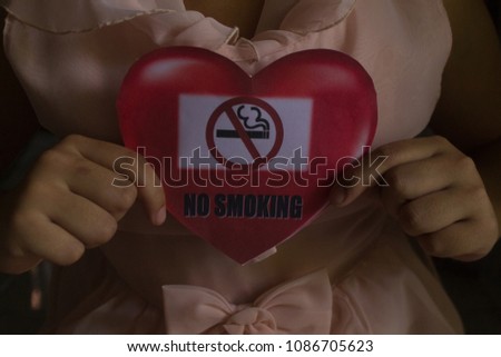 Smoking is prohibited in the hands, hearts, signs the girls.