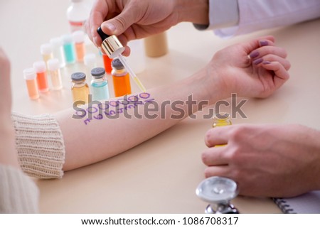 Doctor testing allergy reaction of patient in hospital Royalty-Free Stock Photo #1086708317
