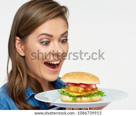 Woman holding white plate with burger. Isolated portrait with copy space.