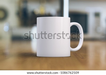 White coffee Mug Mockup. Close-up of a white mug on a wooden table. Great for overlaying your custom quotes and designs for selling mugs.