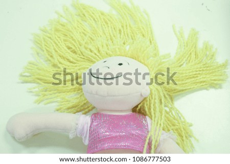a stuffed doll on a white background 