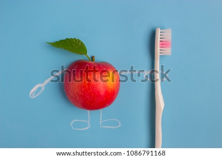 apple character holding a toothbrush on blue background