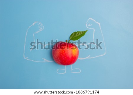 apple character with muscles. fitness and healthy eating concept