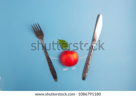 apple character with knife and fork. healthy eating concept