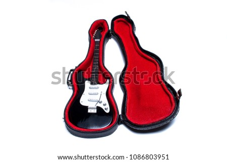 electric guitar in a coffer on a white background