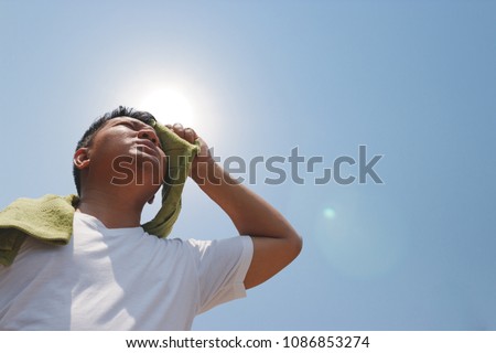 Young man and heat stroke. Royalty-Free Stock Photo #1086853274