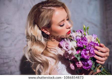 Beauty Blonde Woman Portrait. Beautiful bride with long curly blond hair sitting at the piano. White Hair. Perfect Skin and Make up. Hair Extensions.