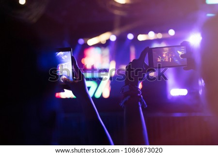 Picture of people recording music performance at festival