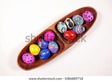 Colorful Easter Eggs in Wooden Plate