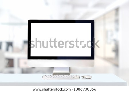 Mockup desktop computer on white desk in office.
