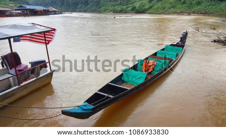 Kuala tahan - Malaysia/April 2018: traditional wooden boat transferring locals and tourists from the village to the other side of the river where they start the trip to Taman negara forest.