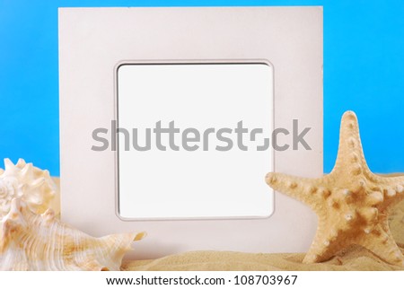 square frame on the beach with seashells and starfish