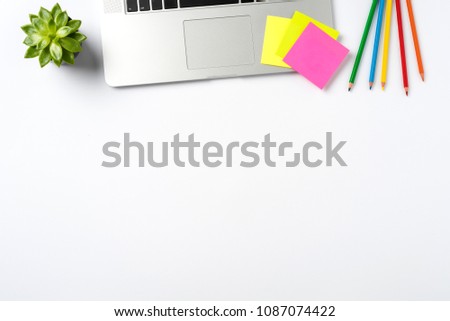 Laptop and accessories on white background with copy space