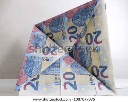 20 euro banknotes folded to form a self-supporting triangular structure