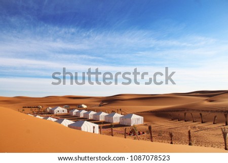 A campsite near the base of a sand dune (Erg Chebbi, Morocco)