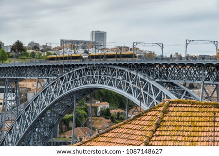 The tram on the Dom Luis I Bridge. Porto, Portugal.