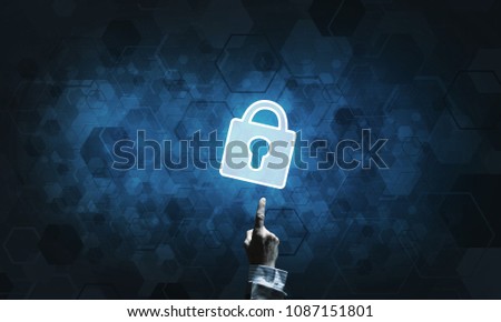 Lock glowing icon pressed with finger on dark background