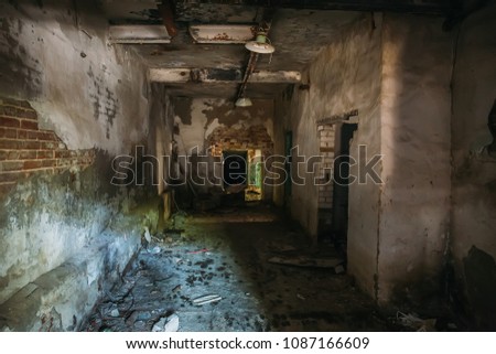Abandoned ruined industrial factory building, corridor view with perspective, ruins and demolition disaster concept, toned