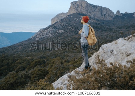 Man with backpack hiking in mountains Travel Lifestyle success concept adventure active vacations outdoor mountaineering sport sunset landscape