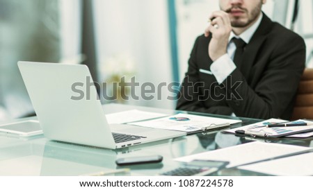 successful businessman working with financial documents at Desk