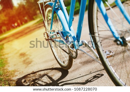 Photo of blue vintage bicycle outdoors