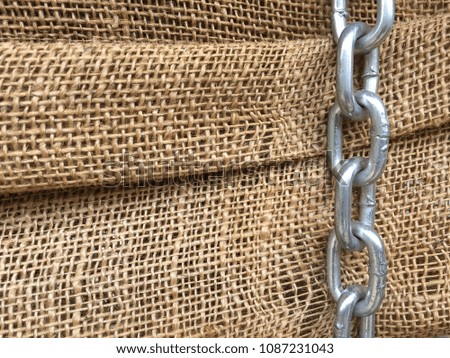 Close up canvas texture with metal chain on the side, background, textured fabric