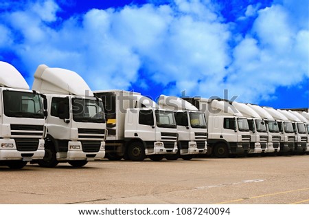 lorry parked up outside a company's car parking area with blue sky no people stock photo