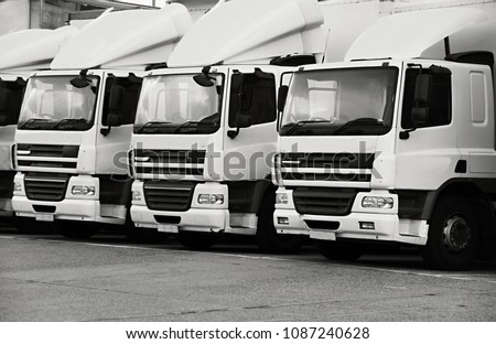 lorries parked up outside a company's car parking area no people stock photo Royalty-Free Stock Photo #1087240628