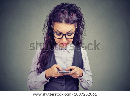 Nerdy girl using a new smart phone 