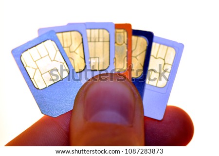 Hand holding SIM card for mobile phones, smartphones and tablets