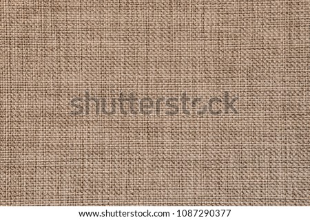 Seamless generic rough jute texture background in natural colours.