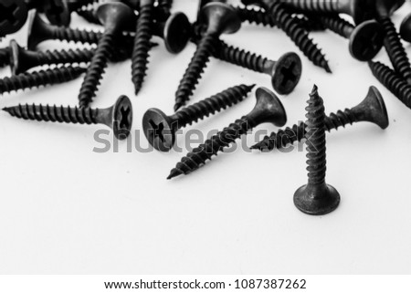 screws, stainless nuts and bolts on white background. top view Picture space for text message, flat lay Banner for website.