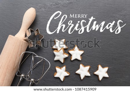 Christmas background with cinnamon cookies on slate