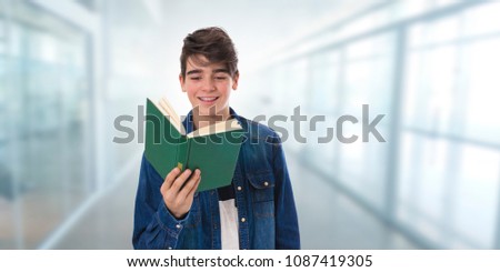 teenage student with open book learning or reading