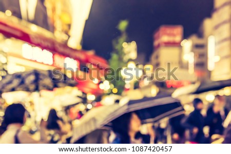 Abstract Blurred image of Street night market with light bokeh for background usage. (vintage tone)