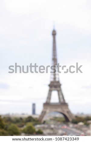 Out of focus Eiffel Tower background. Concept of Paris and France landmark.
