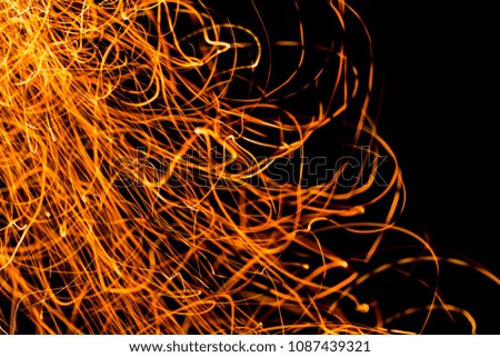 Transparent realistic fire sparkles.  Defocused trails lines bokeh sparkle or particles. Template for design