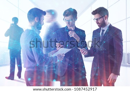 Young businesspeople standing in modern office interior with sunlight and polygonal patter. Toned image. Teamwork, meeting and technology concept. Double exposure 