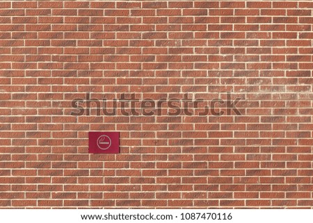 sign "place for smoking" on the background of a brick wall