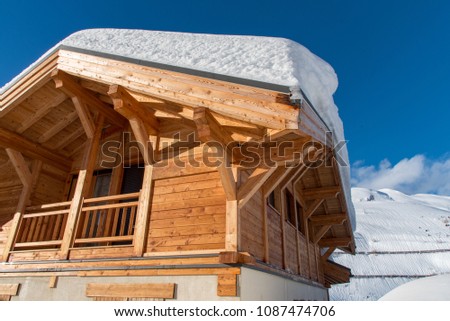 Solo traditional timber chalet pictured, covered with heavy snow from Storm Eleanor, January 2018. Located at the end of a street in Tignes Le Lac 2100, French Alps, France. 