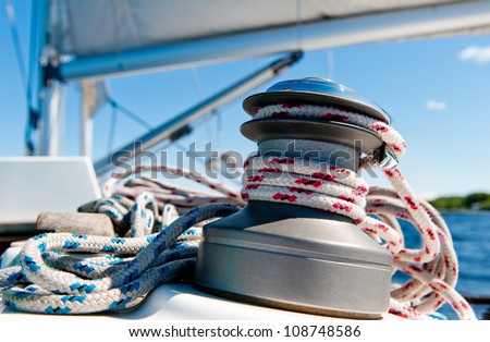 Winch with rope on sailing boat Royalty-Free Stock Photo #108748586
