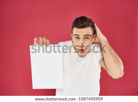 handsome man with a piece of paper                      