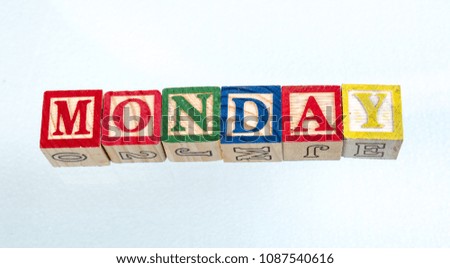 The phrase Monday visually displayed on a white background using colorful toy blocks image with copy space in landscape format